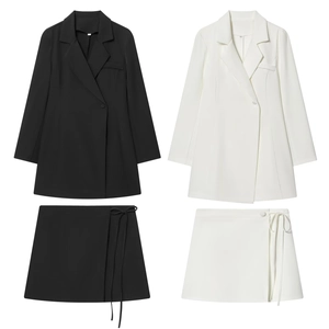 Elegant women's two-piece skirt suit with blazer and belted skirt in black and white