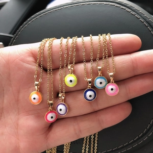 Collection of teardrop evil eye necklaces in seven vibrant colors on gold chains