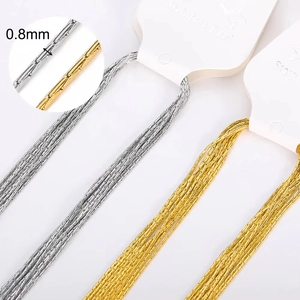 Macro detail of 0.8mm stainless steel DIY chains in gold and silver finishes