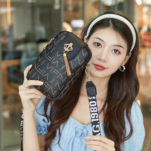 Black PU leather crossbody bag with VIFEN pattern, golden crown tassel, and printed wide strap