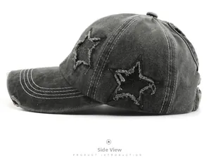 Side view of dark gray washed denim baseball cap with star patches and contrast stitching