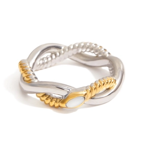 Two-tone twisted snake ring with gold and silver bands and white oval center stone