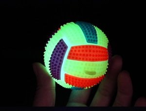 Close-up of small glowing spiky volleyball toy with colorful LED light modules