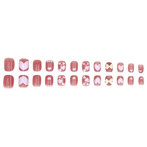 Pink press-on nails set with 3D bows, pearls and heart patterns on white background
