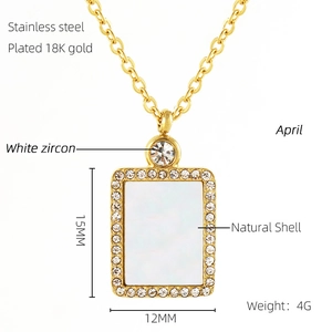Detail of 18K gold plated stainless steel necklace with natural shell and zircon pendant