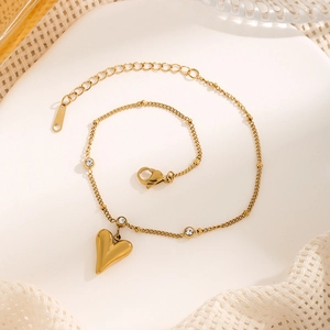Elegant gold heart anklet with sparkling zircon stones and adjustable chain extension
