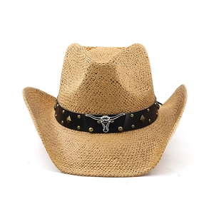 Close-up of western straw cowboy hat featuring a silver bull head logo and metal studs
