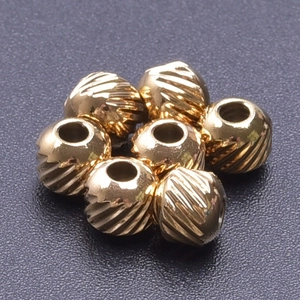 7 pieces of 18k gold plated 304 stainless steel beads with diagonal textured engraving