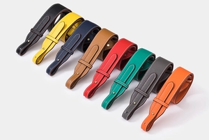 Close-up of litchi grain leather shoulder straps with gold hardware in eight colors