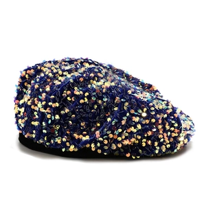 Blue velvet beret hat with iridescent sequins and black rim trim on a white background