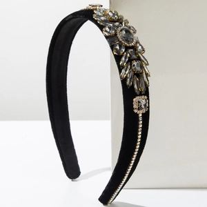 Close-up of velvet headband with smoke grey crystal flowers and sparkling rhinestones