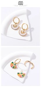 Detailed shot of fan-shaped enamel earrings with vibrant colors and gold metal hoops