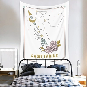 Detailed Sagittarius astrology wall tapestry hanging over a bed in a cozy bedroom setup