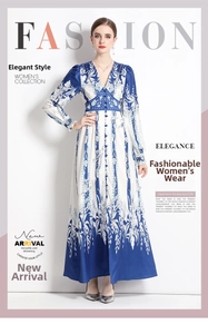 Detail of the V-neck and floral pattern on this elegant white and blue maxi dress