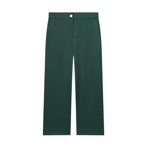Pantalon large vert foncé taille haute avec bouton en métal doré sur fond blanc uni