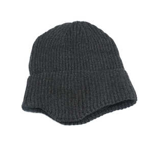 Detail of winter knit beanie showing thick vertical stripe texture and wide cuff