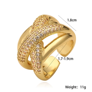 Detailed view of gold geometric ring with zircon stones including size measurements