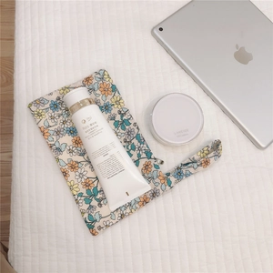 Floral cotton small storage pouch for cosmetics and daily essentials with handheld strap
