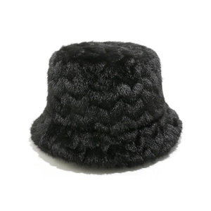 Close-up of thick black faux mink fur bucket hat showing soft texture and warm fiber detail