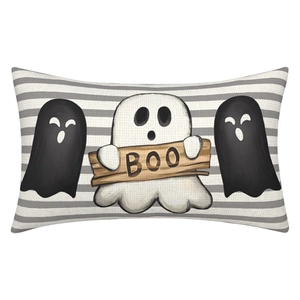 Detail of Halloween ghost pillowcase with BOO sign on textured linen fabric