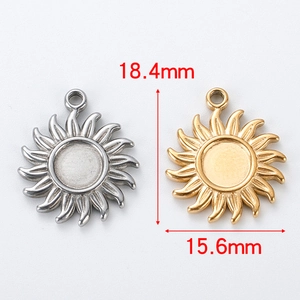 Detail showing gold and silver sunflower pendants with dimensions 18.4mm and 15.6mm