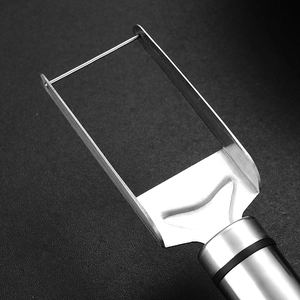 Dual-purpose stainless steel watermelon slicer and fruit fork with ergonomic black grip