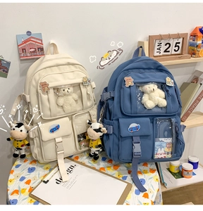 Cute ins style canvas backpack with transparent pocket and plush toy, perfect for students.