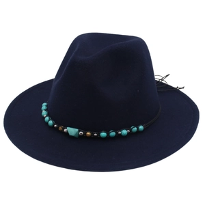 Detail of navy blue felt fedora with ethnic band featuring turquoise and metallic beads
