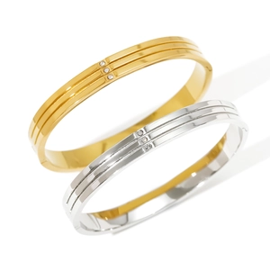 Minimalist 18K gold and silver stainless steel bangles set with three crystal accents