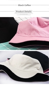 Close-up of double-sided cotton bucket hat with precision stitching and pink canvas texture