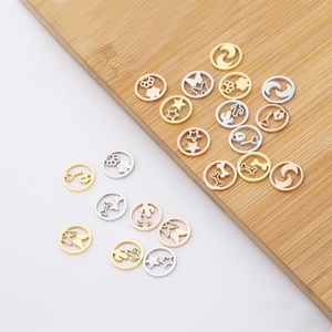 Mix of hollow circular metal charms with stars and moons in gold and silver finish