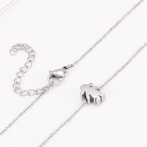 Polished stainless steel necklace featuring a stylized girl pendant with lobster clasp