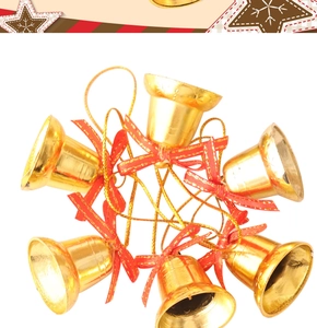 Close-up of 6 golden Christmas bells with red ribbon bows arranged in a circular ring ornament