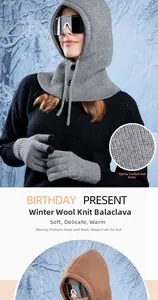 Close-up of winter knit Balaclava with neck warmer and matching gloves in snowy forest