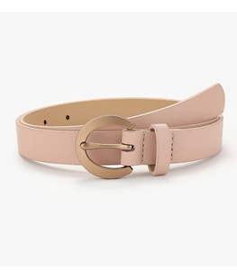 Detailed view of pink faux leather belt with a round golden buckle on white background
