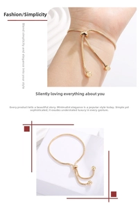 Detail of adjustable gold snake chain bracelet with sliding clasp and bead endings
