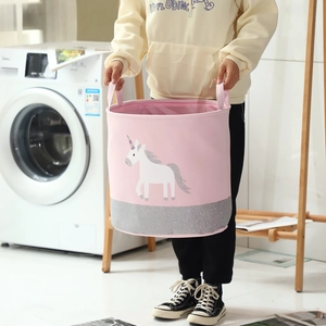 Detail of pink unicorn laundry basket with sparkly glitter base and fabric handles