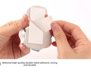 Detail of the extra wide adhesive backing being peeled for a cartoon plug organizer