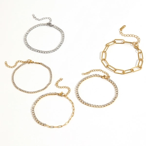 Five assorted 18k gold and silver tennis bracelets with glittering cubic zirconia stones