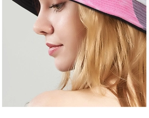 Detail view of pink and purple patchwork cotton sun hat showing fabric texture and color contrast