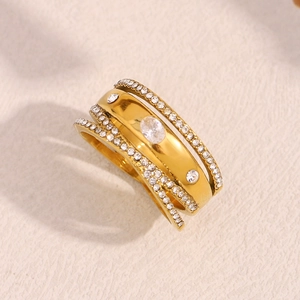 Macro view of multi-layer 18K gold plated ring with white cubic zirconia pavé setting