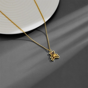18k gold plated titanium steel necklace with brown teddy bear pendant on white plate