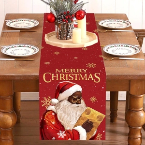 Festive red Christmas table runner with Santa pattern and golden snowflake decorations