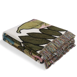 Nordic woven blanket with tropical leaf pattern and colorful tassels for sofa or office