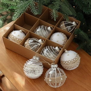 9-piece 8cm Christmas ball set with pearls and lace in a craft box on a wooden table