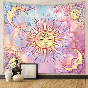 Detail of bohemian sun and moon tapestry with celestial clouds and astrology pattern