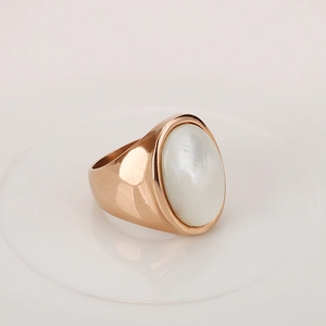 Vintage rose gold stainless steel ring featuring a large oval shell-like center stone