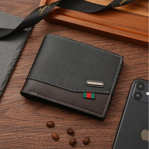 Detailed view of bifold leather wallet with black lychee grain and dark brown stitching