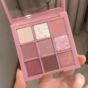 Nine-color eyeshadow palette with matte and shimmer shades in rose and earthy tones