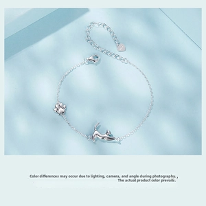 Detailed view of S925 sterling silver bracelet featuring cute cat and paw charms